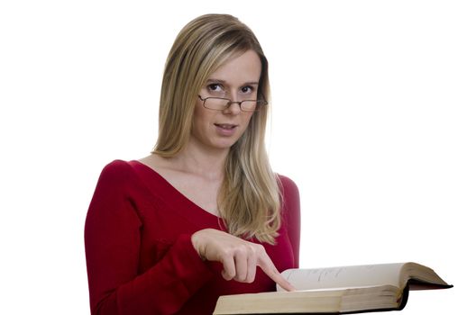 portrait of a young woman with glasses reading a book isolated on white background