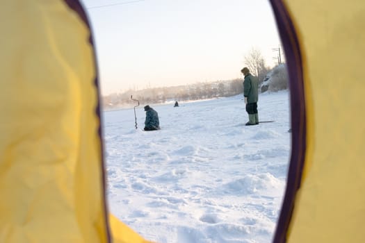 The fisher on winter fishing pending a biting