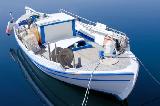 fishing boat in Crete of a blue sea