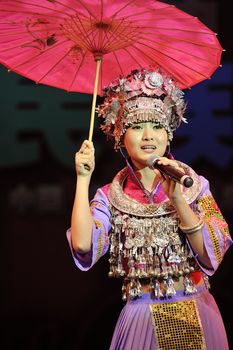 CHENGDU - SEP 28: chinese Miao ethnic singer performs on stage in the 6th Sichuan minority nationality culture festival at JINJIANG theater.Sep 28,2010 in Chengdu, China.