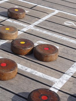 Close up photo of a Shuffle board game on a cruise ship deck