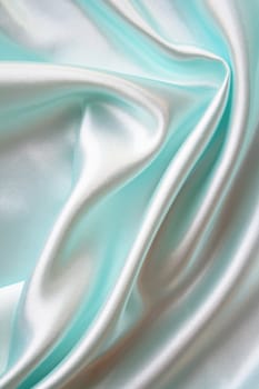 Smooth elegant blue silk as background 