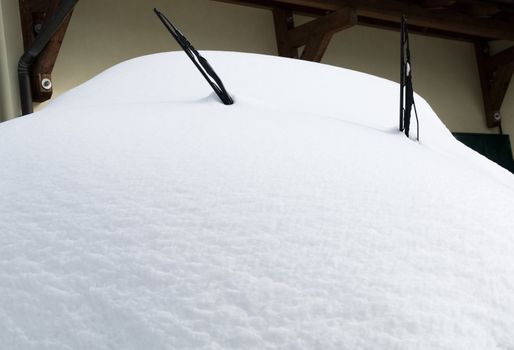 Car hidden in snow a winter day at Castelvetro