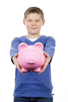 young boy with pink piggybank on white background