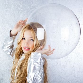 Astronaut futuristic kid girl with silver uniform and glass helmet