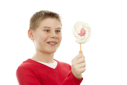 Portrait of joyful boy with lollipop