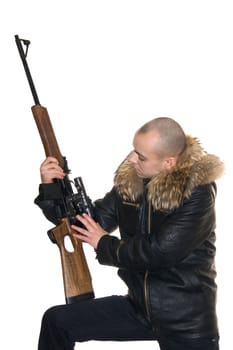 Young the man considers a carbine with an optical sight