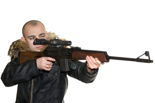 Young the man aims from a carbine with an optical sight