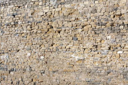 an old stone wall consisting of parts of the stone