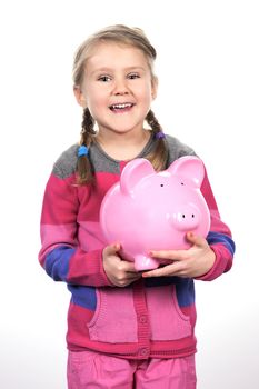 girl shaking a piggy bank 