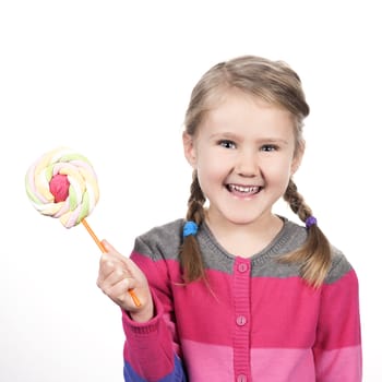 Little girl with lollipop isolated on white background