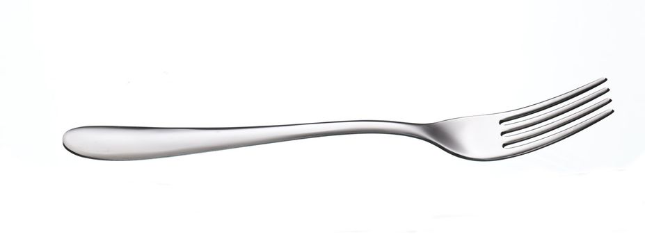 shiny silver fork over white background with reflection