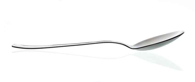 silver shiny kitchen table spoon over white