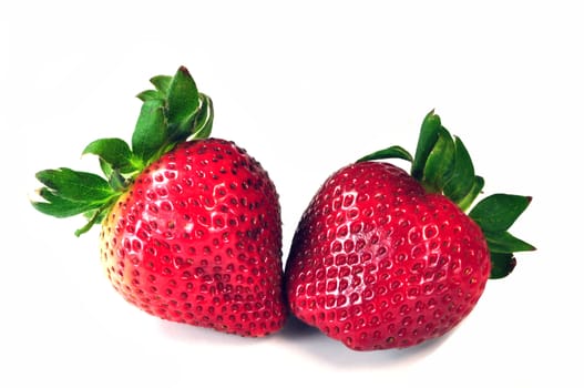 Two colorful tasty strawberries on white background. 