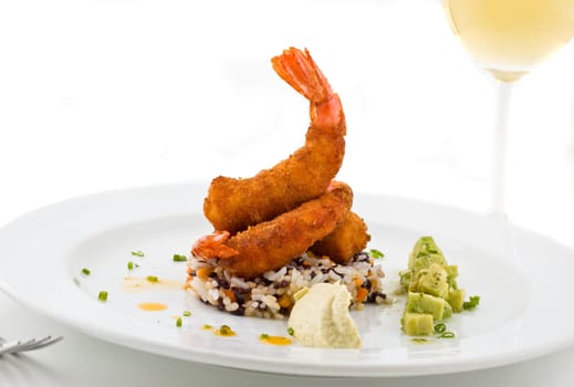 Gourmet seafood dish, with rice, shrimps and avocado.