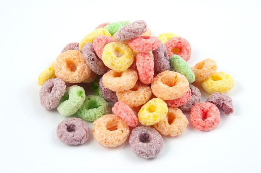 A pile of colored cereal isolated on white.