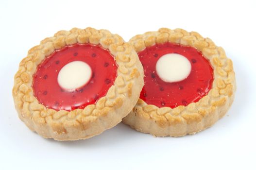 Two strawberry cookies isolated on a white background