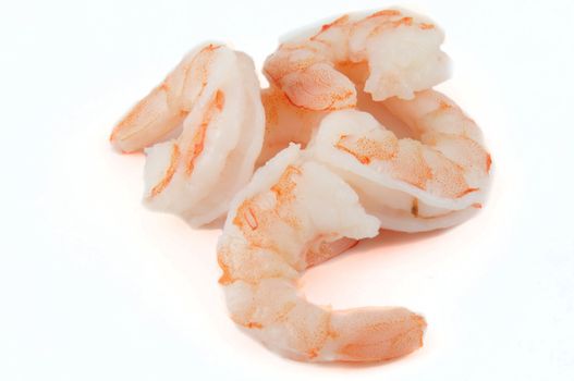 A pile of shelled shrimps isolated on white.