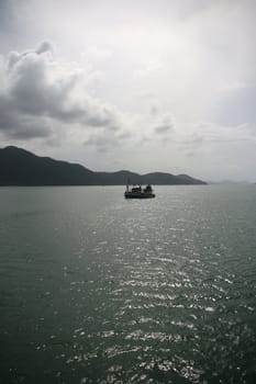 fishing boat in a cloudy day koh chang island thailand