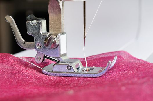 Sewing machine close up with a cloth.