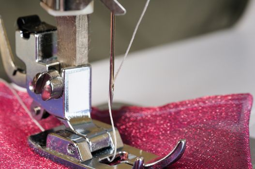 Sewing machine close up with a cloth.