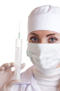 Woman doctor in mask with syringe over white