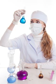 Scientist woman in lab coat with chemical glassware isolated on white