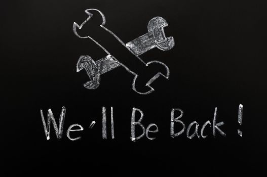 Under construction and we'll be back written on a blackboard