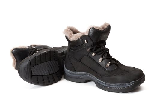 Black winter man's boots on a white background