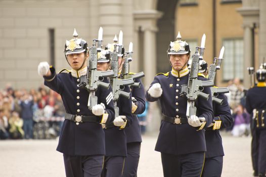 Relieved guard after the changing of the guards ceremony at the Royal Palace. The clear blue uniform is used solely by the soldiers of the Cavalry Battalion.