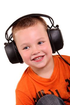Little boy in headphones on the white background

