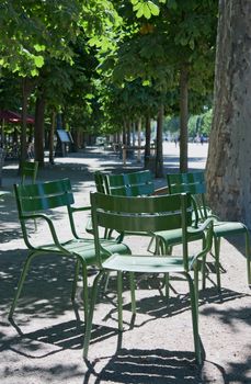 Chairs for public use in an path of the Tuileries Gardens in Paris