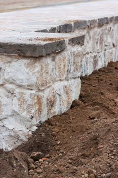 Step construction of a thick stone wall