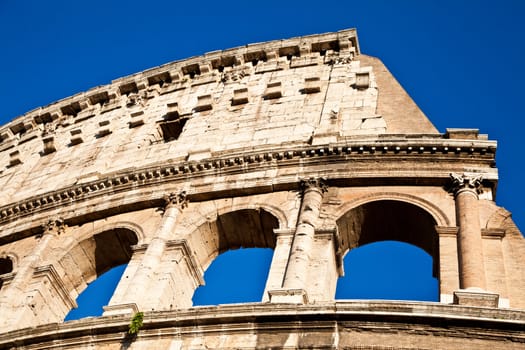 Colosseum in Rome with blue sky, landmark of the city
