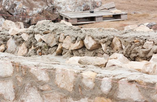 Step construction of a thick stone wall