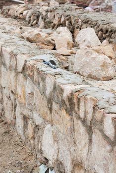 Step construction of a thick stone wall