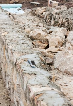 Step construction of a thick stone wall