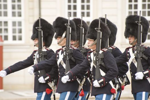 The Royal Danish Guard patrols the royal residence Amalienborg Palace and serves the royal Danish family. Amalienborg is also known for the Danish Royal Guard, who patrol the palace grounds. The Danish Royal Guard march from Rosenborg Castle at 11.30am daily through the streets of Copenhagen, and execute the changing of the guard in front of Amalienborg Palace at noon. When the Queen is in reside