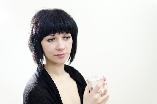 Portrait of brunette girl with glass.