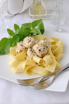 Italian pasta - Pappardelle with chicken fillet in a creamy sauce with sesame seeds