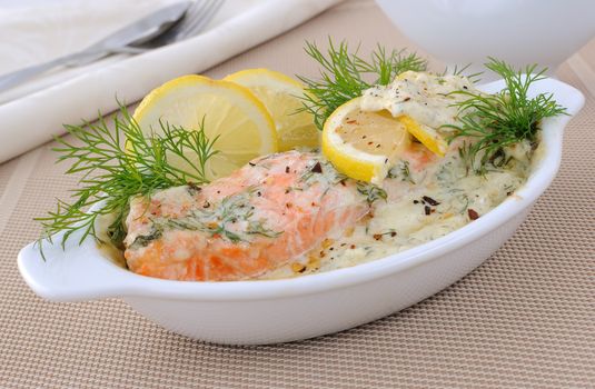 Salmon under gentle creamy lemon sauce with spices