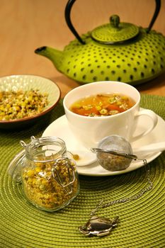 Closeup of chamomile  tea with asian teapot