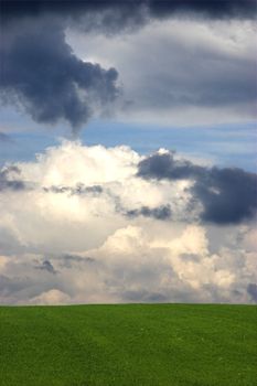 Beautiful green hill with a nice cloudy sky