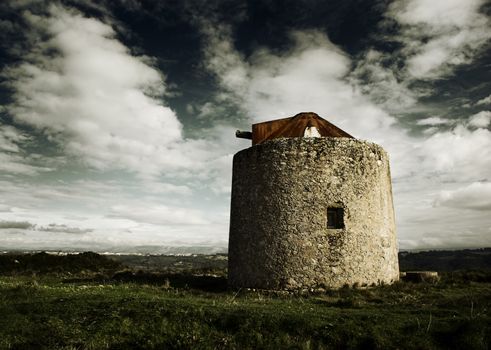 Landscape picture with an old vintage windmill - Colors adjusted in PS 