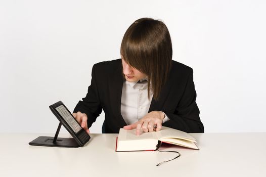 A student with both a paper and and ebook