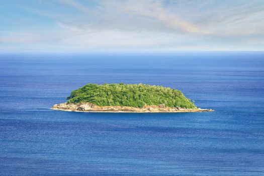 A lonely tropical island in the ocean. Thailand, Phuket, Rawai.