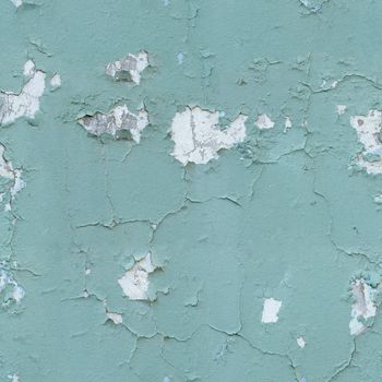 The seamless texture - cracked old blue paint on the wall