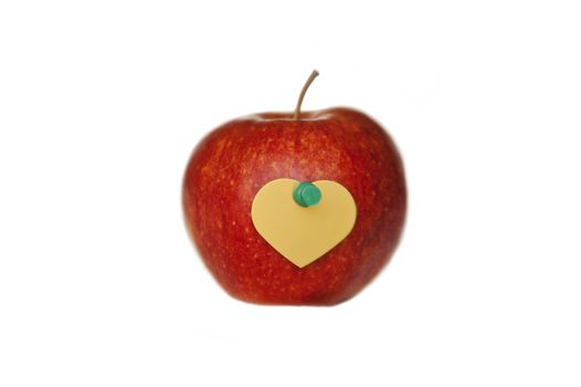 An apple with symbolic heart image from paper