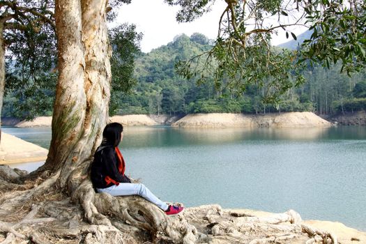 Asian woman thinking outdoor and feel relax