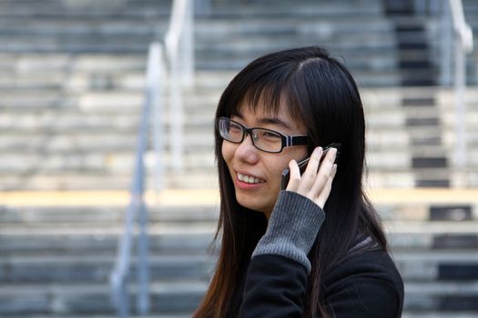 Asian woman talking phone